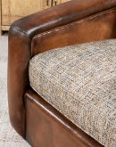 Ella Cocoa Swivel Chair featuring a blend of hand-burnished leather and tweed fabric upholstery, showcasing a sleek design with a hardwood frame and swivel mechanism.