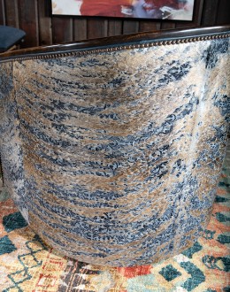 Huckleberry Swivel Chair barrel swivel chair with dark blue leather and cowhide on the outside