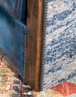 Huckleberry Swivel Chair barrel swivel chair with dark blue leather and cowhide on the outside