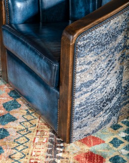 Huckleberry Swivel Chair barrel swivel chair with dark blue leather and cowhide on the outside