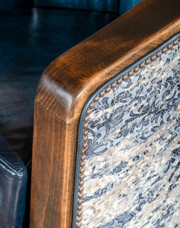 Huckleberry Swivel Chair barrel swivel chair with dark blue leather and cowhide on the outside