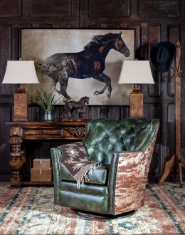 swivel and rocker chair with tufted green leather and cowhide on the outside