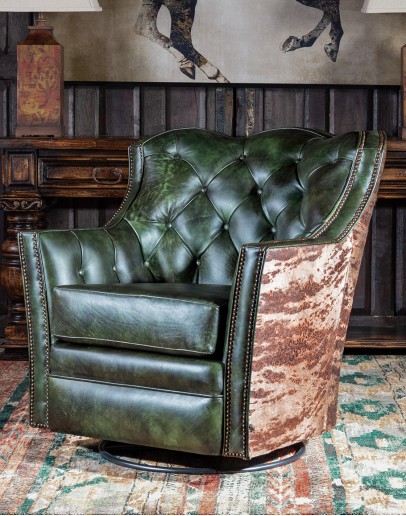 Mezcal Swivel Glider swivel and rocker chair with tufted green leather and cowhide on the outside
