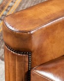 high end Leather Swivel Chair in rich saddle leather, featuring pleated stitched channels, brass nail tacks, and large flat armrests for exceptional comfort.