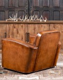 high end Leather Swivel Chair in rich saddle leather, featuring pleated stitched channels, brass nail tacks, and large flat armrests for exceptional comfort.