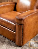 high end Leather Swivel Chair in rich saddle leather, featuring pleated stitched channels, brass nail tacks, and large flat armrests for exceptional comfort.