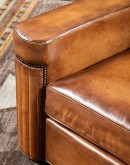 high end Leather Swivel Chair in rich saddle leather, featuring pleated stitched channels, brass nail tacks, and large flat armrests for exceptional comfort.