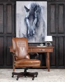 executive desk chair in distressed tan saddle leather with boot stitch design on seat back