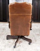 executive desk chair in distressed tan saddle leather with boot stitch design on seat back