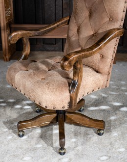 desk chair with distressed tan tufted leather