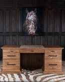 This is an image of the TX Executive Desk by Adobe Interiors. The desk is crafted from rustic Pecky Hickory Wood with a Vintage Natural finish. The solid wood-edged top with a top-grain-leather writing surface is clearly visible. Seven drawers, including