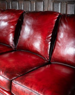 small dark red leather sofa