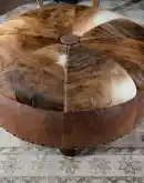 42 inch round ottoman with distressed brown leather and brindle cowhide on top
