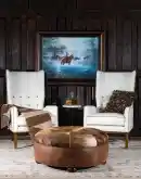 42 inch round ottoman with distressed brown leather and brindle cowhide on top